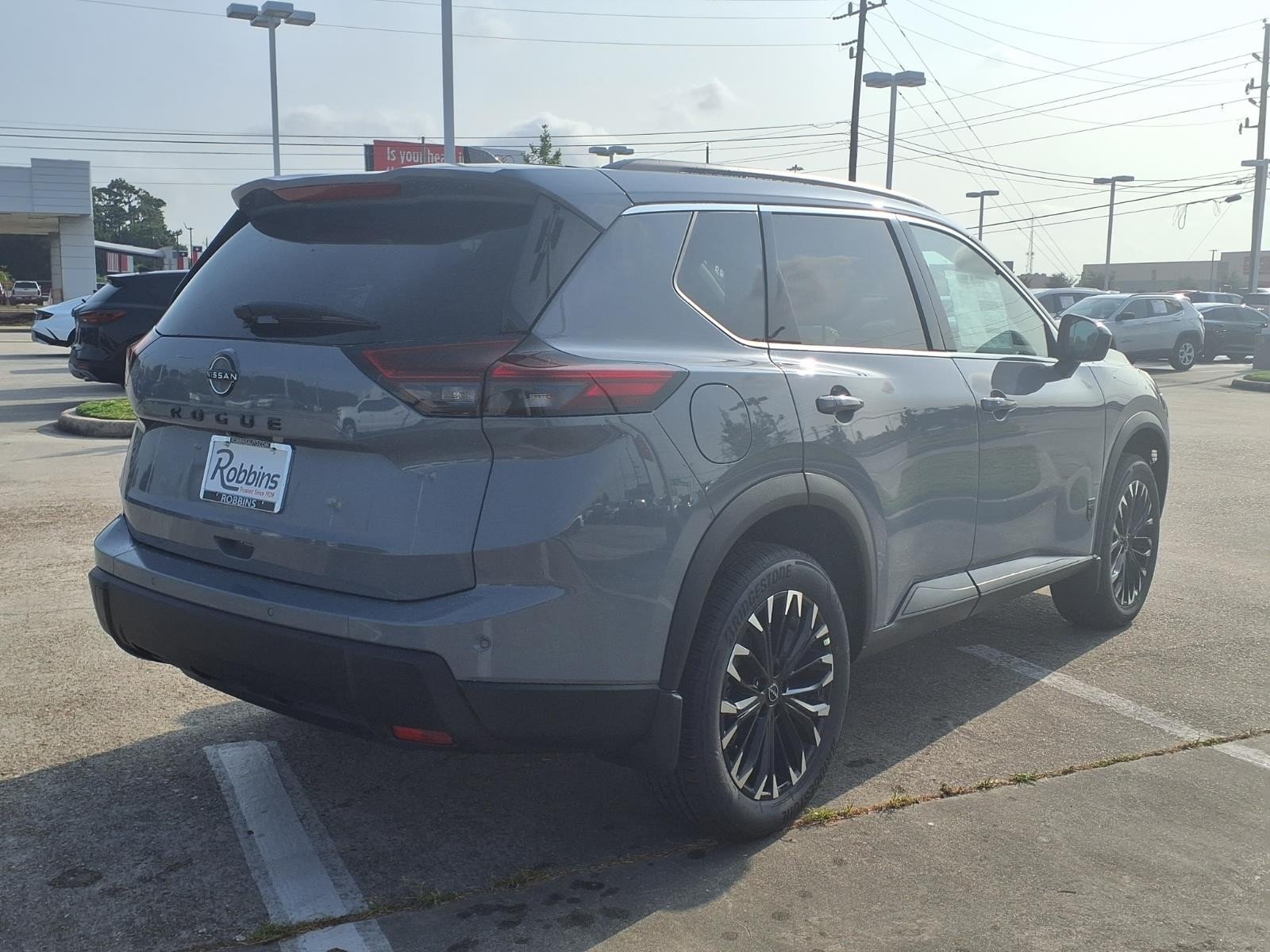 New 2026 Boulder Gray Pearl Nissan Dark Armor image 2