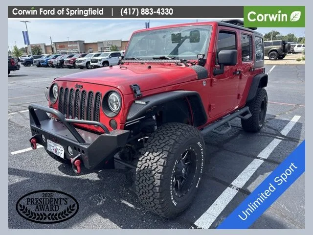 Used 2015 Firecracker Red Jeep Unlimited Sport image 1