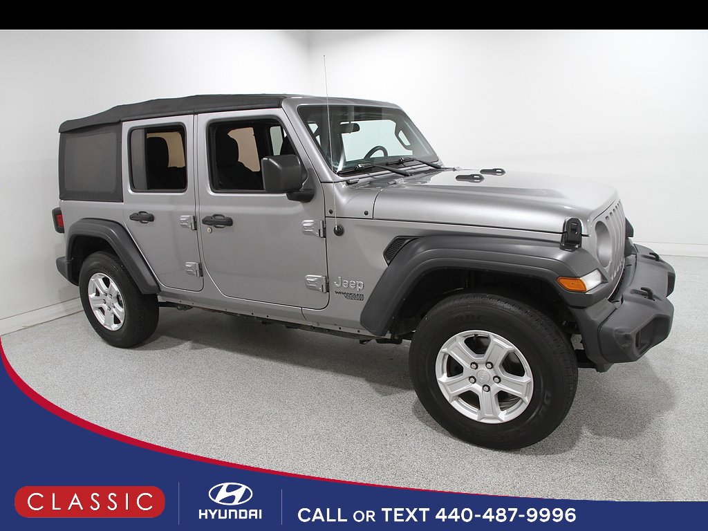 Used 2018 Billet Silver Metallic Clear Coat Jeep Sport S image 1