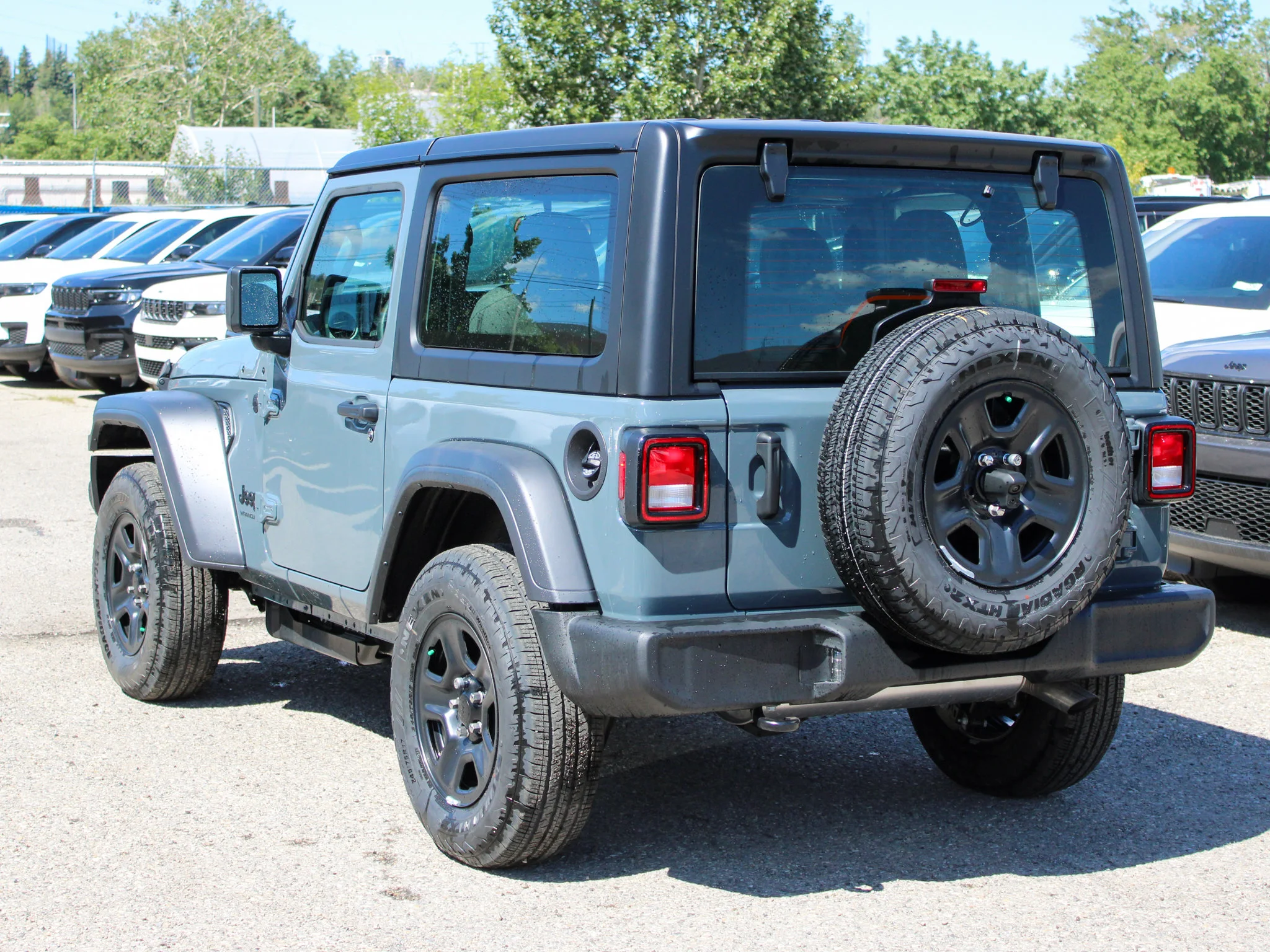 New 2026 Dark blue Jeep Sport* image 2