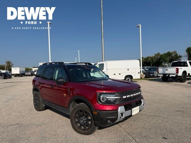 Used 2025 Ruby Red Metallic Ford Badlands image 1