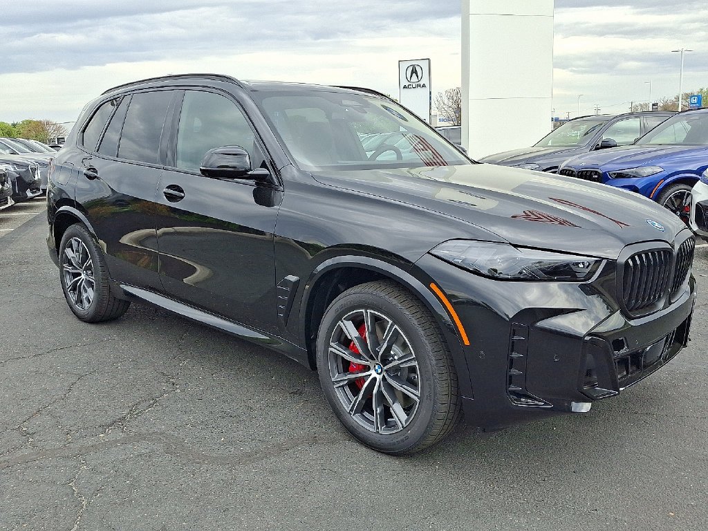 Used 2026 Black Sapphire Metallic BMW xDrive50e image 2