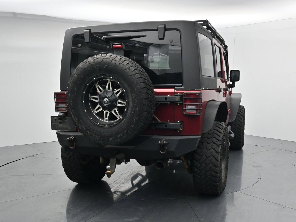 Used 2012 Red Jeep Unlimited Sport image 6