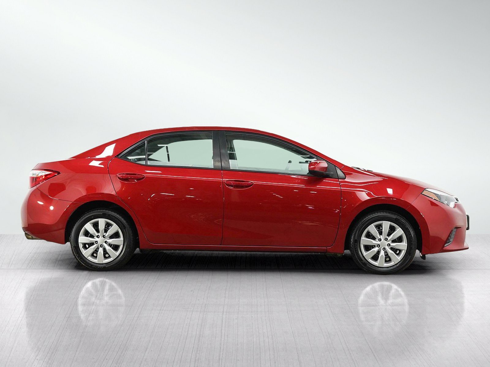Used 2016 Barcelona Red Metallic Toyota LE image 6