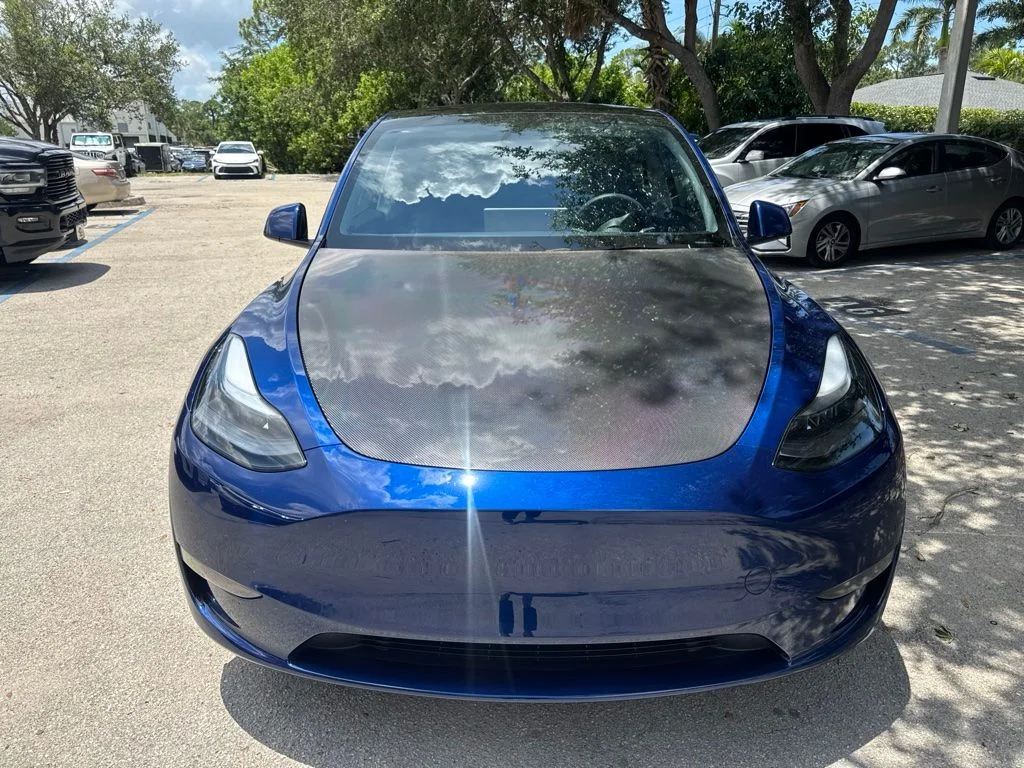 Used 2025 Tesla Model Y Long Range with VIN 7SAYGDEDXSF234963 for sale in Naples, FL