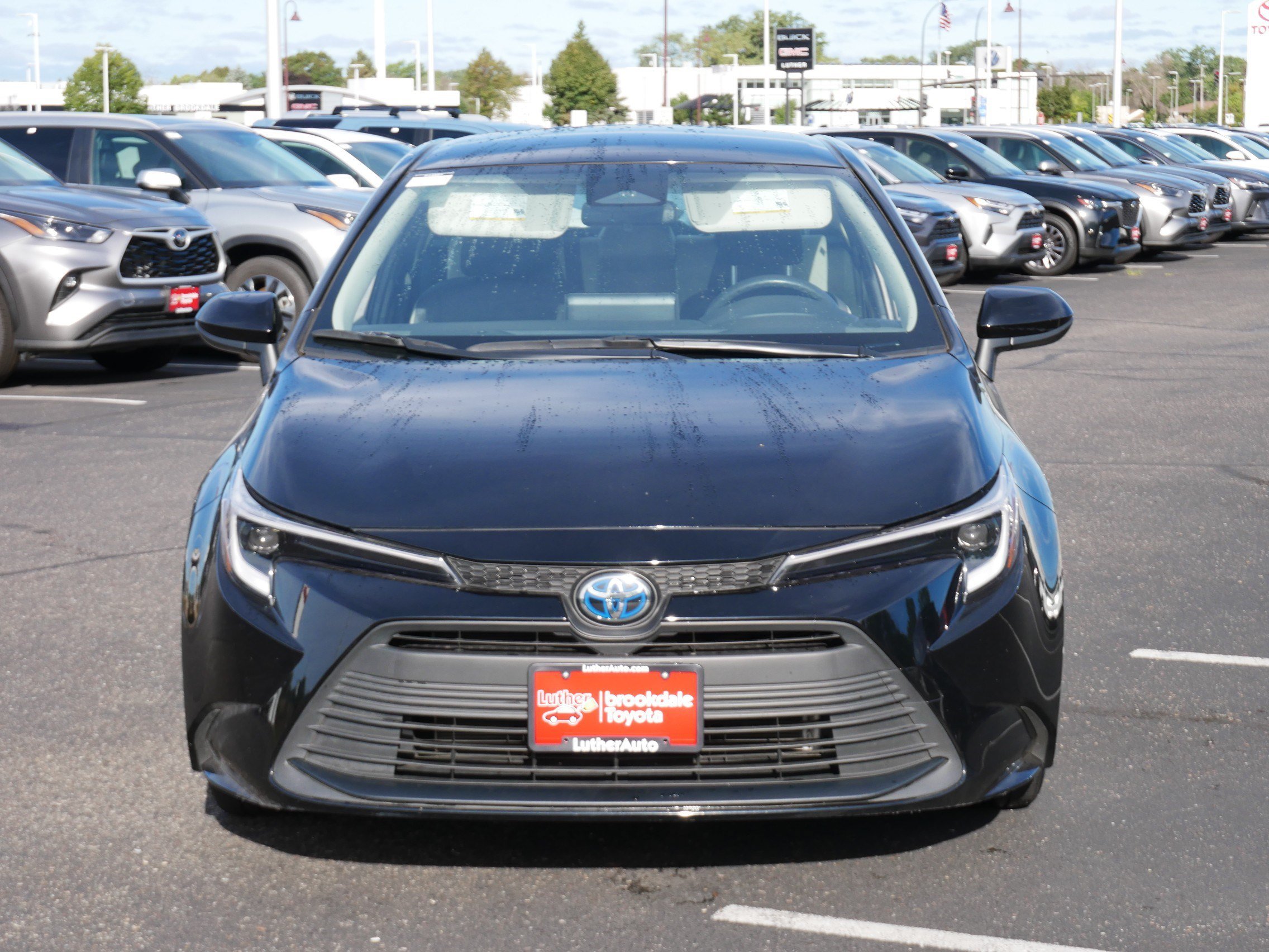 Used 2025 Midnight Black Metallic Toyota Hybrid LE image 2