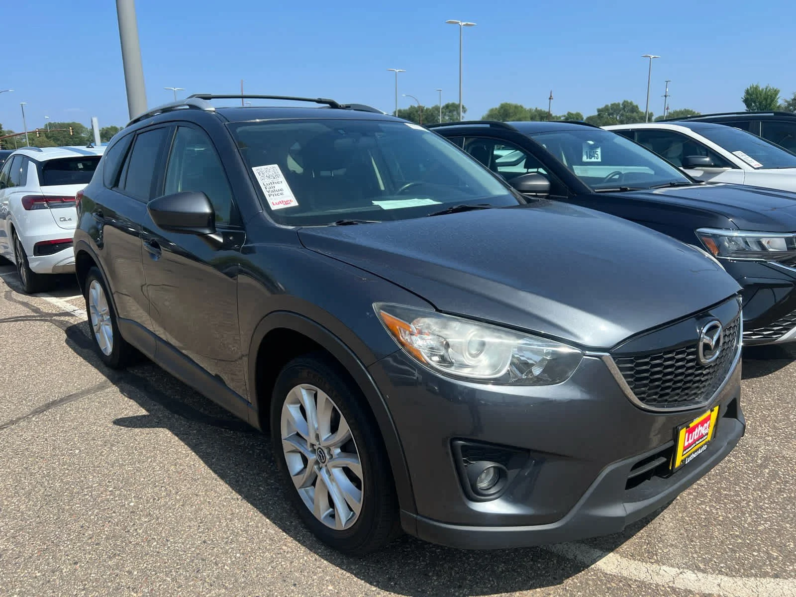 Used 2014 Mazda CX-5 Grand Touring with VIN JM3KE4DY8E0309859 for sale in Brooklyn Center, Minnesota