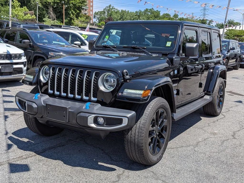 Used 2022 Black Jeep Unlimited Sahara 4xe image 1