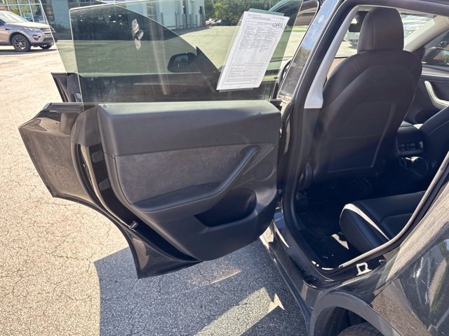 Used 2023 Solid Black Tesla Performance image 11