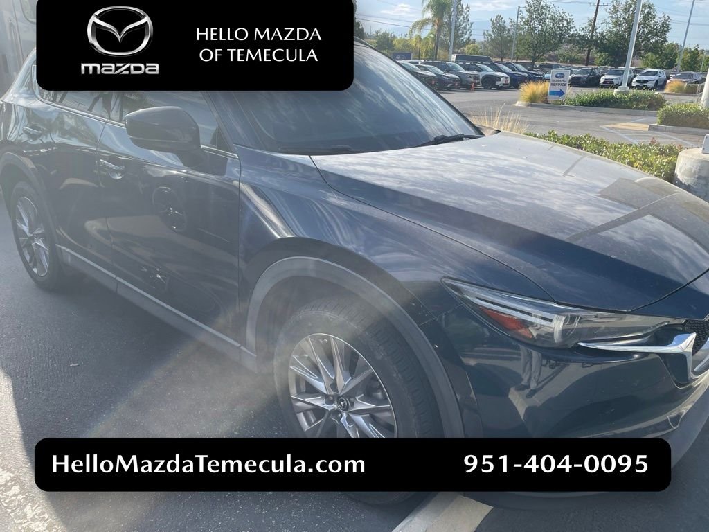 Used 2019 Crystal Blue Mazda Grand Touring image 1
