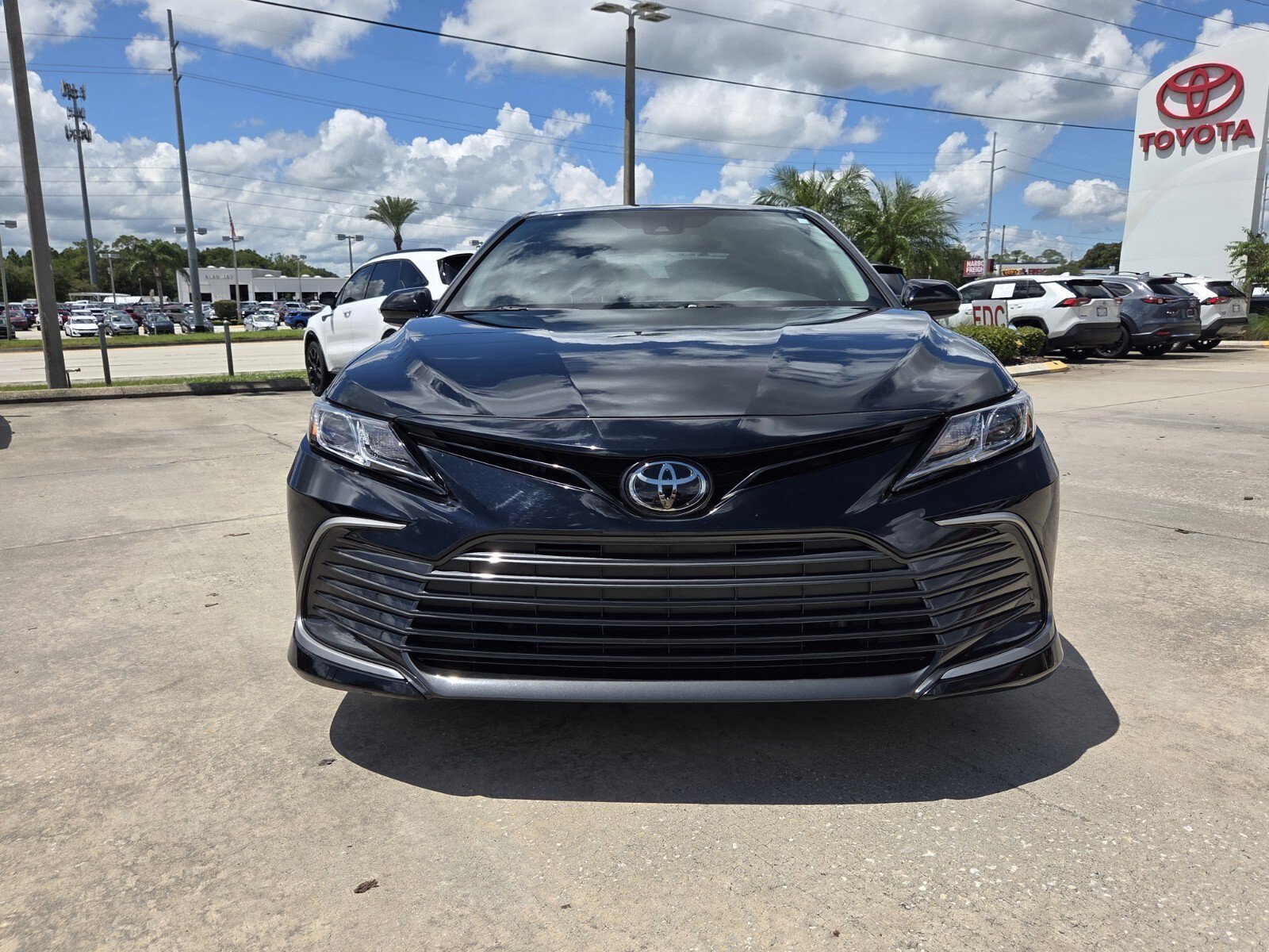 Used 2024 Midnight Black Metallic Toyota LE image 1