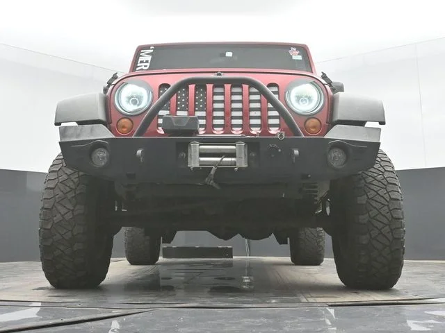 Used 2012 Red Jeep Unlimited Sport image 26