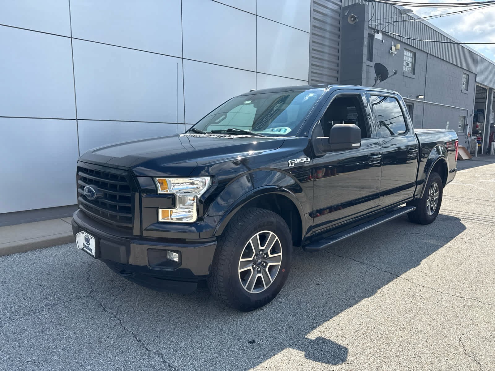 Used 2016 Shadow Black Ford XLT 4WD SuperCrew 145 image 1