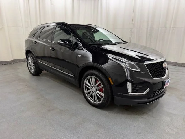 Used 2025 Black Cadillac Sport image 1