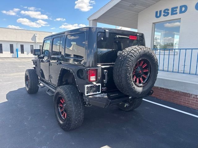 Used 2013 Black Jeep Unlimited Sahara image 6
