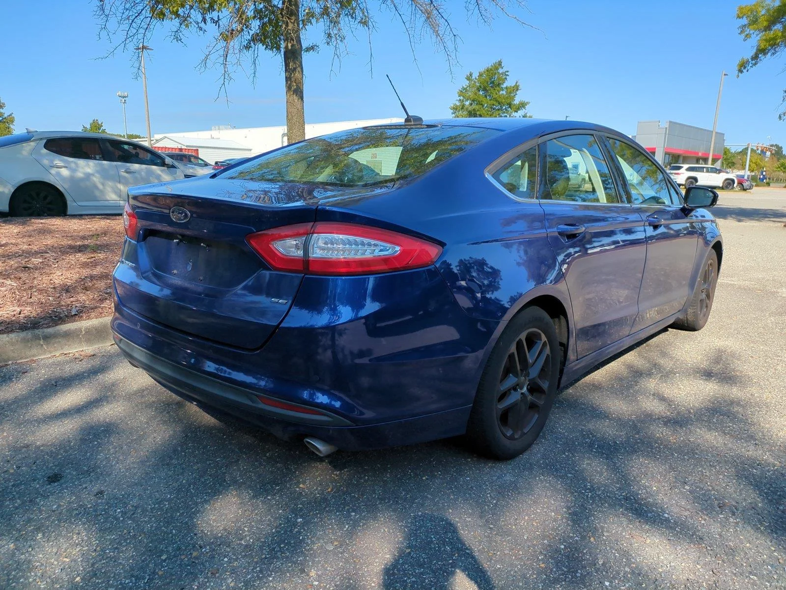 Used 2016 Deep Impact Blue Ford SE image 4