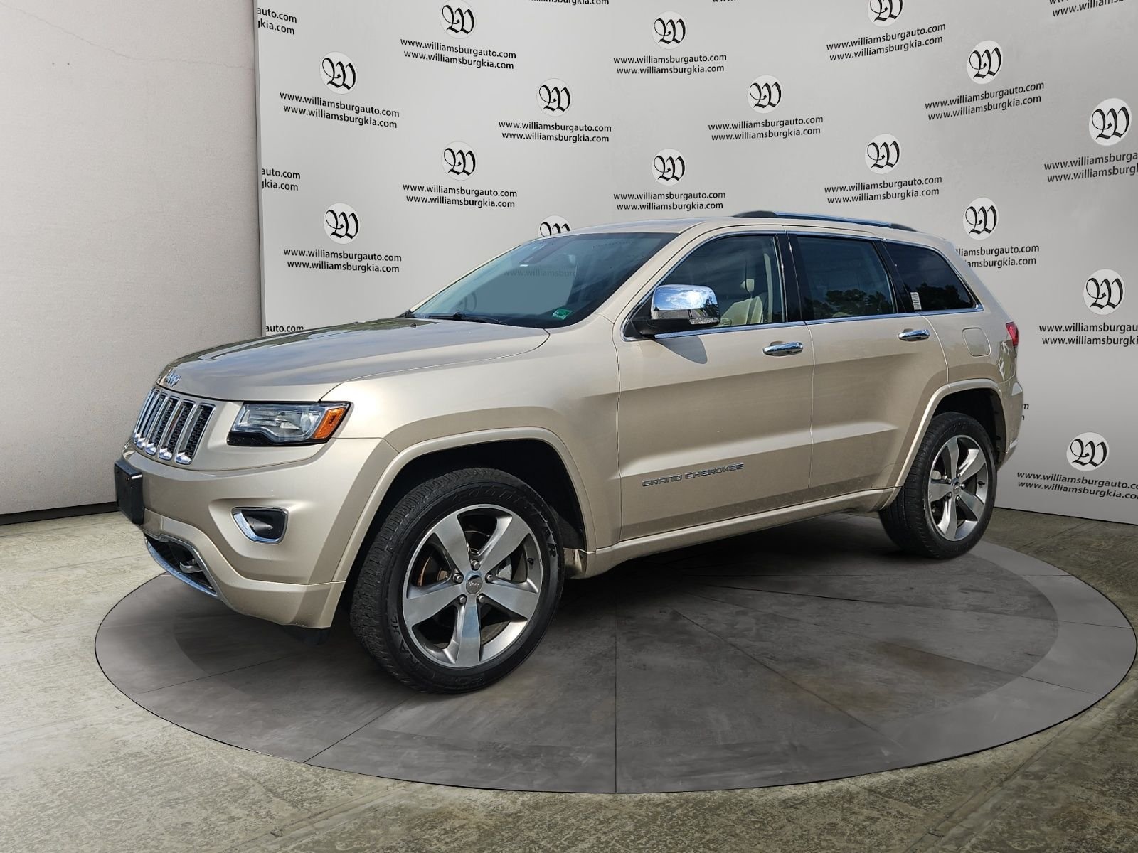 Used 2014 Gold Jeep Overland image 1