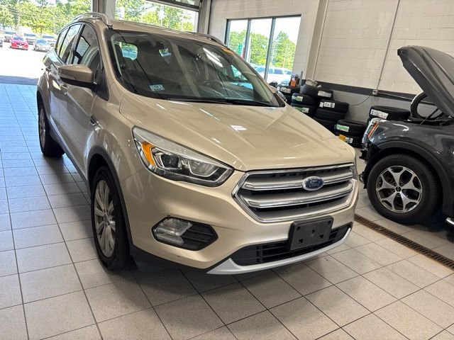 Used 2017 Gold Ford Titanium image 1