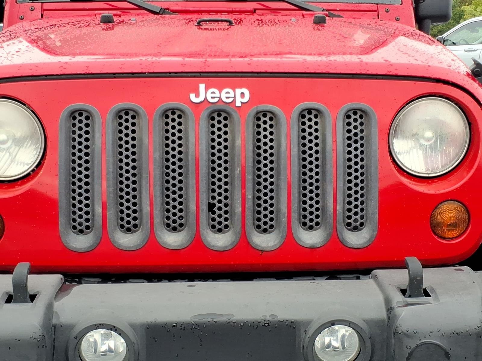 Used 2013 Flame Red Clearcoat Jeep Sport image 13