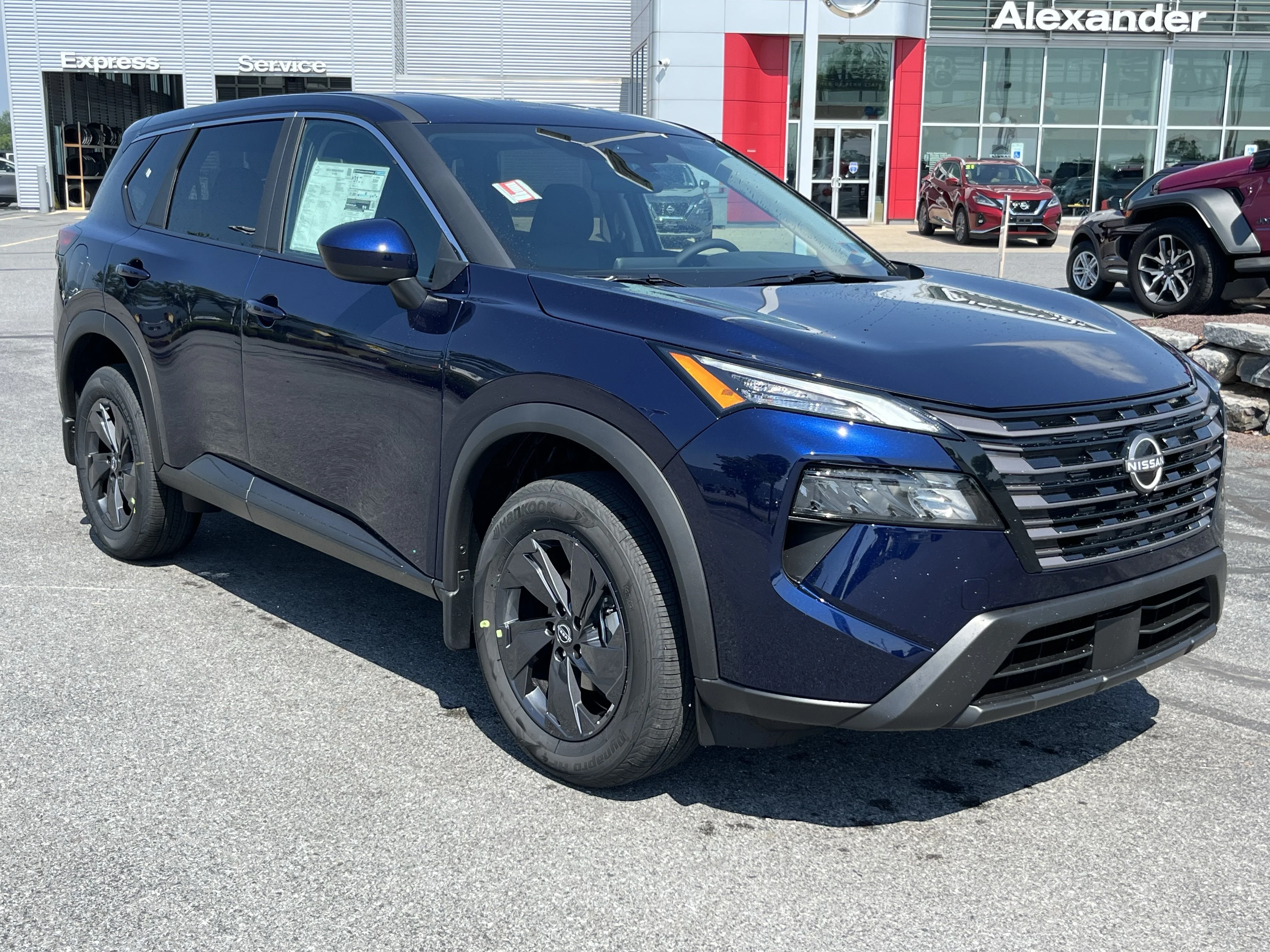 New 2026 Deep Ocean Blue Pearl Nissan SV image 1