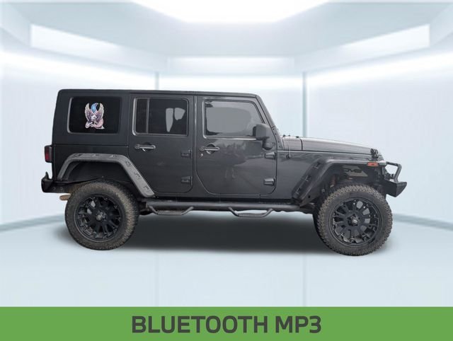 Used 2010 Gray Jeep Unlimited Sport image 2
