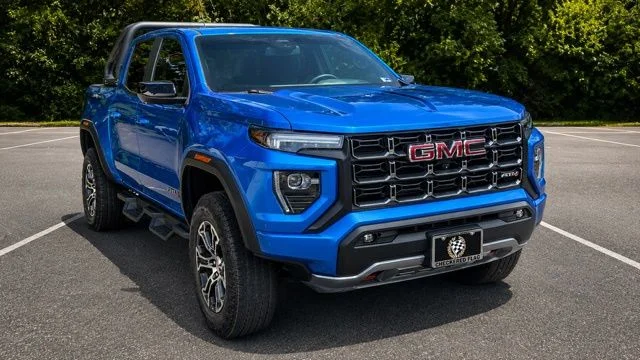 Used 2023 Dynamic Blue Metallic GMC AT4 image 1