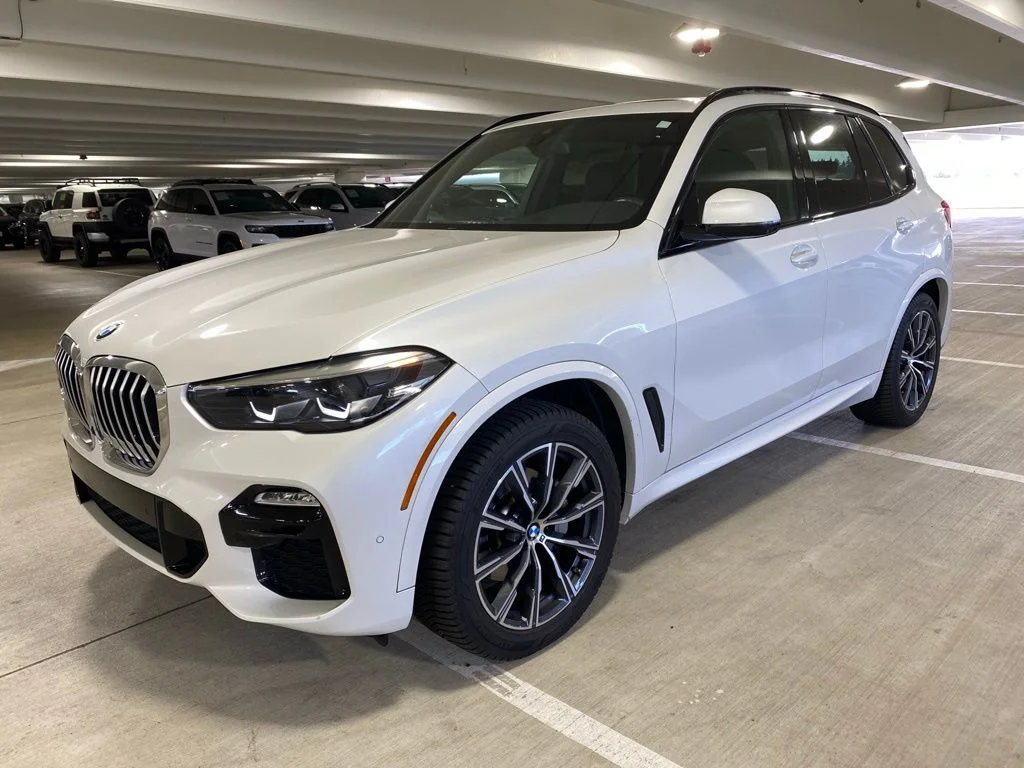 Used 2021 Mineral White Metallic BMW xDrive40i image 1