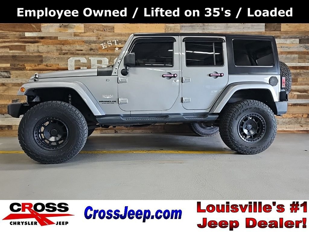 Used 2014 Billet Metallic Clearcoat Jeep Unlimited Sahara image 1