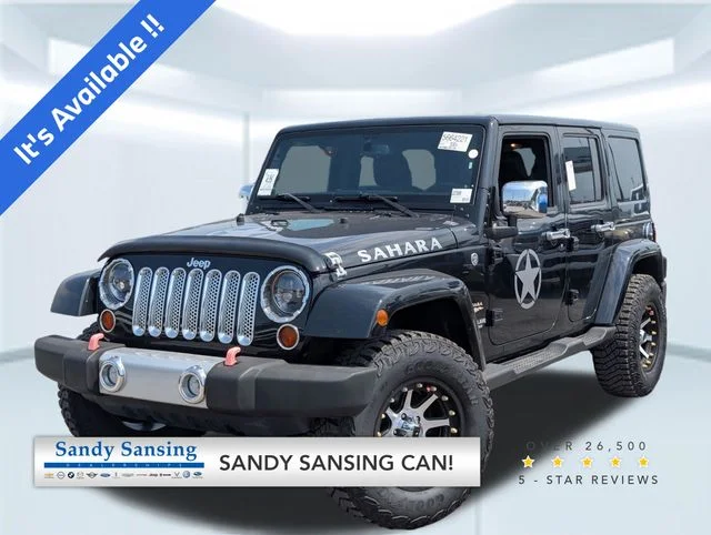 Used 2013 Black Jeep Unlimited Sahara image 1