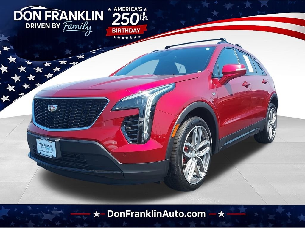 Used 2021 Red Cadillac Sport image 1