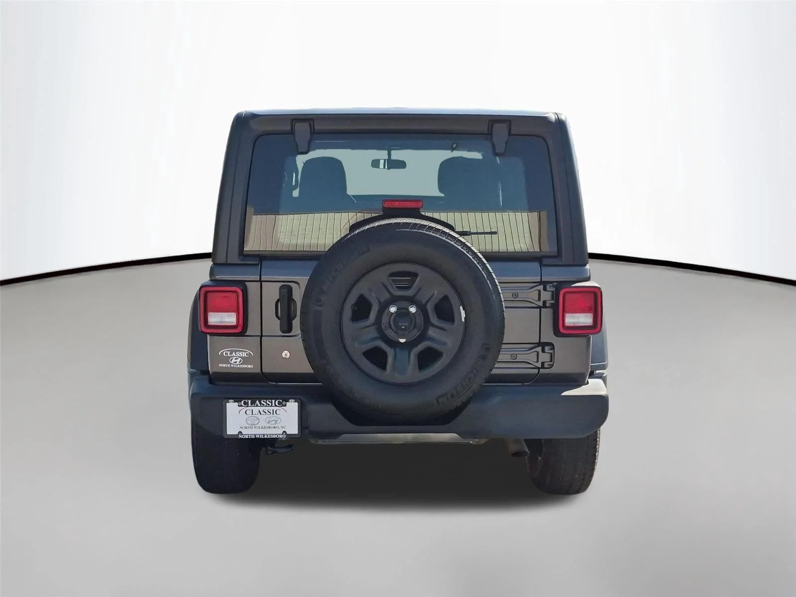 Used 2022 Granite Crystal Metallic Clearcoat Jeep Unlimited Sport image 4