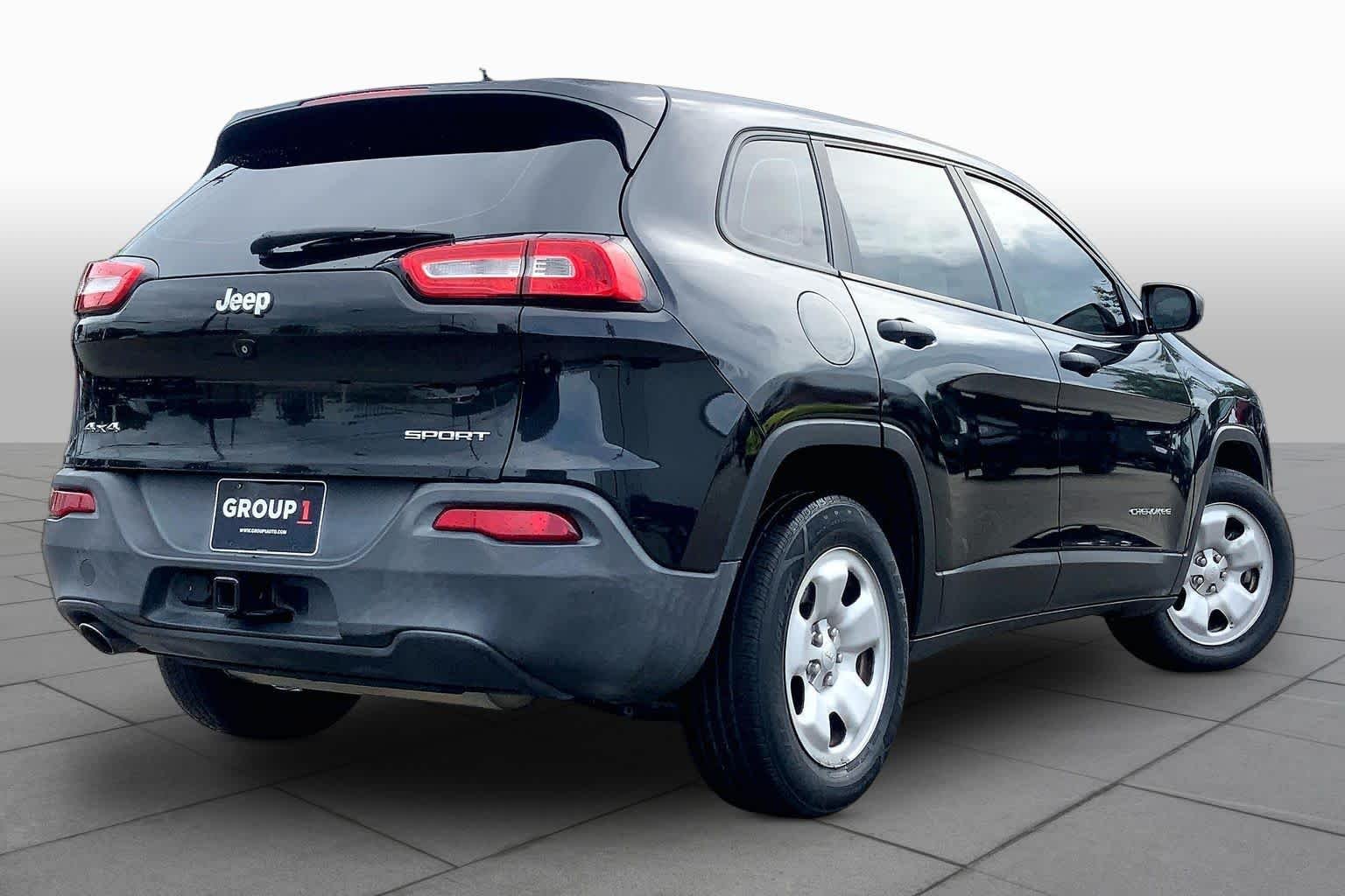 Used 2014 Brilliant Black Crystal Pearlcoat Jeep Sport image 11