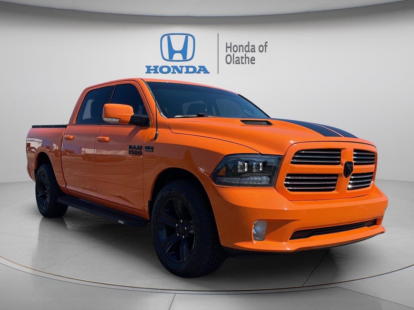 Used 2017 Ignition Orange Clearcoat Ram Sport image 1