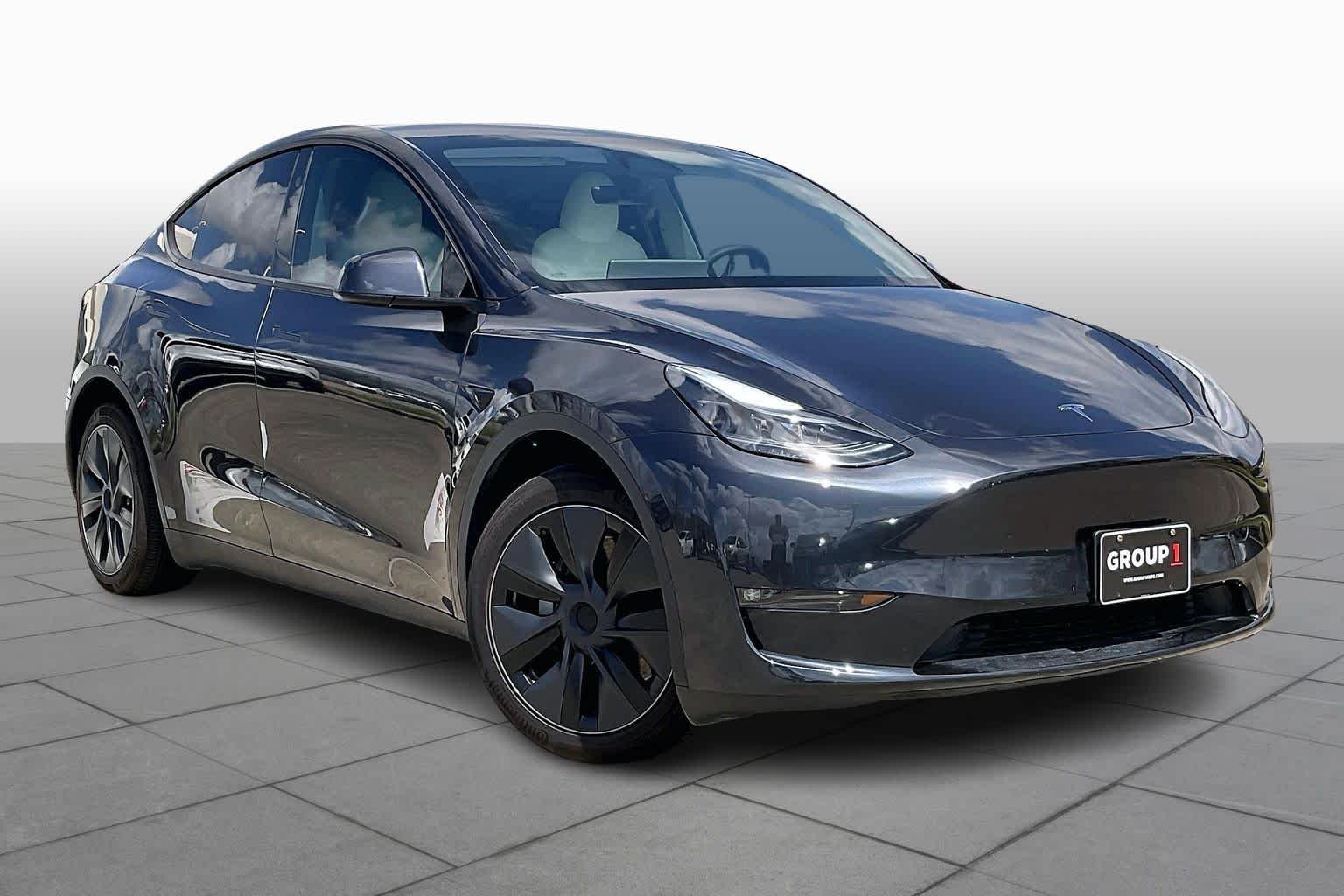 Used 2024 Tesla Model Y Long Range with VIN 7SAYGAEE1RF205708 for sale in Houston, TX