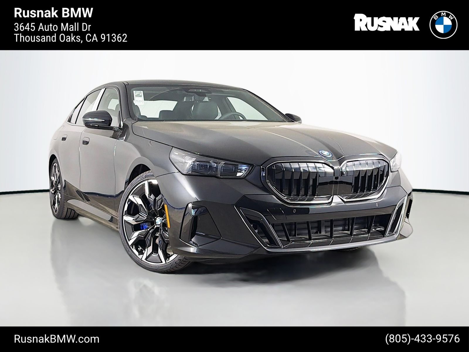 New 2027 Black Sapphire Metallic BMW 550e xDrive image 1
