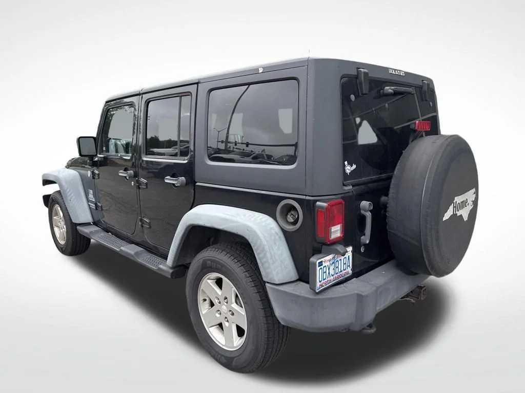 Used 2012 Black Jeep Unlimited Sport image 15