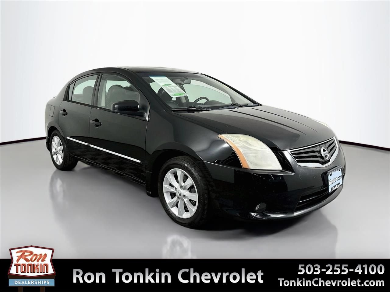Used 2011 Super Black Metallic Nissan 2.0 SL image 1