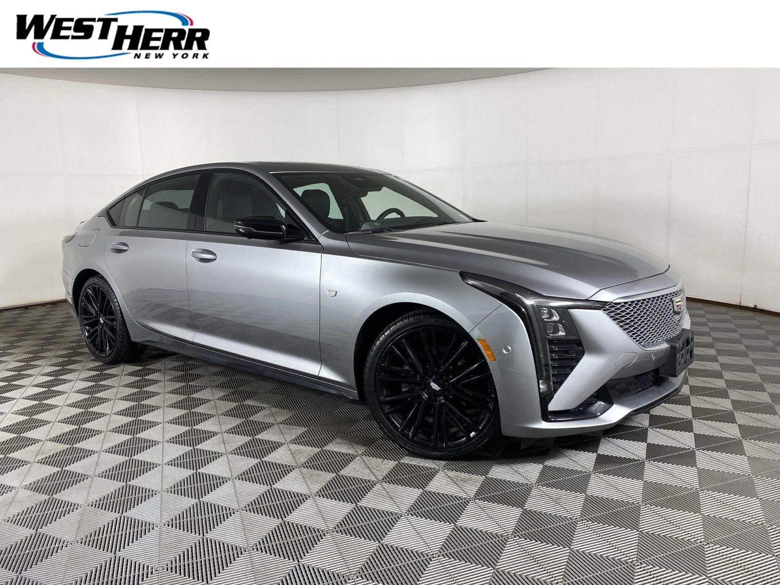 Used 2025 Argent Silver Metallic Cadillac Sport image 1