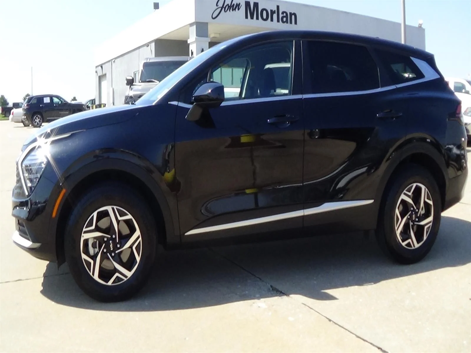 Used 2025 Ebony Black (eb) Kia LX image 1