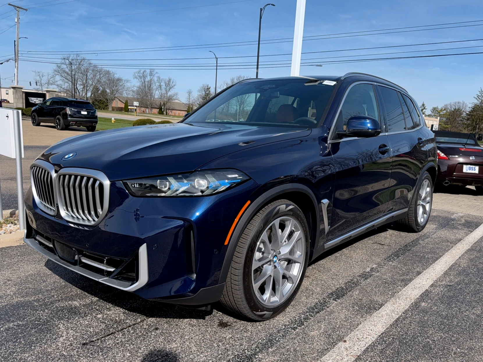 New 2026 Tanzanite Blue II Metallic BMW xDrive50e image 1