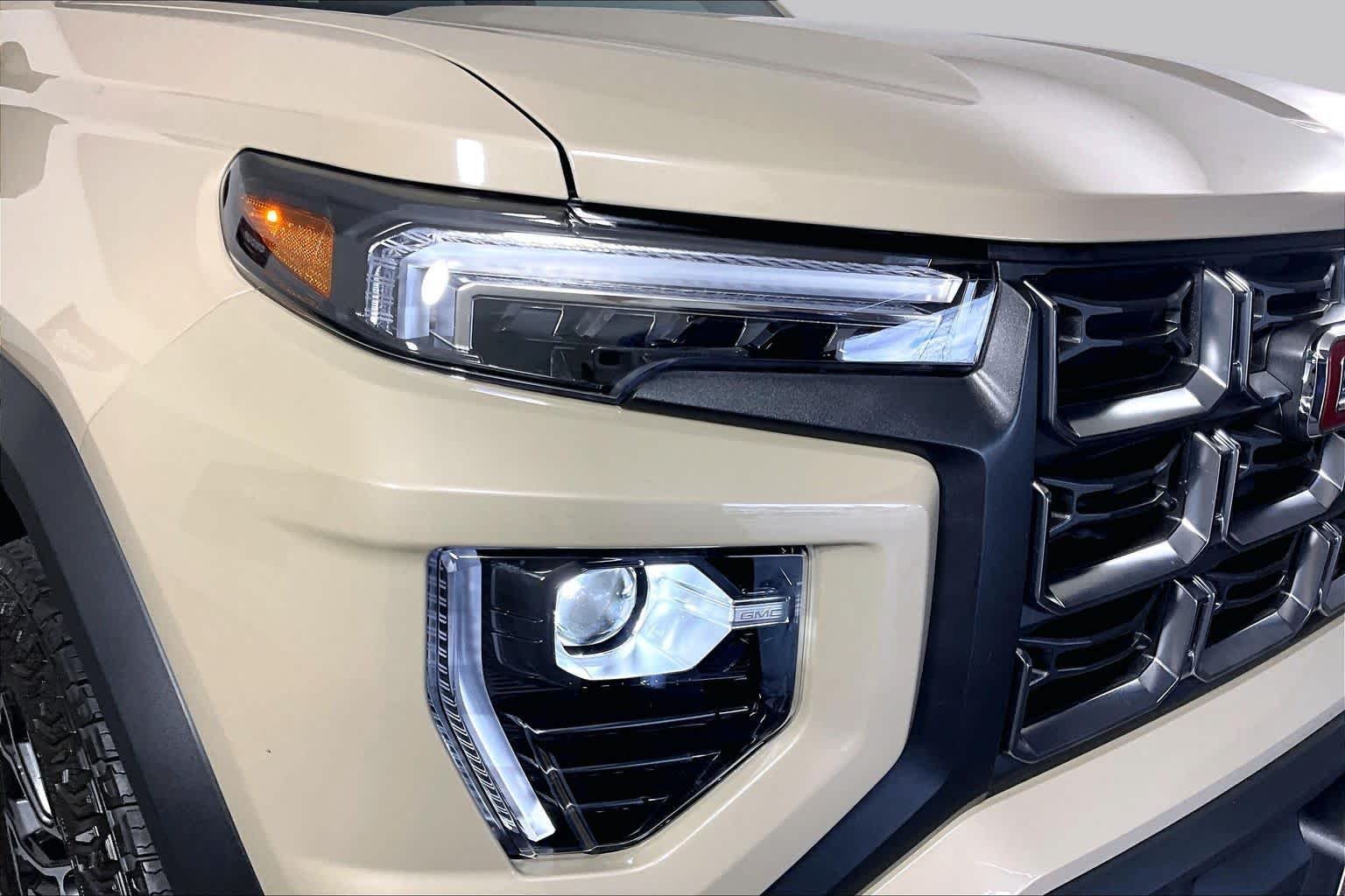 Used 2024 Desert Sand Metallic GMC 4WD AT4 image 23