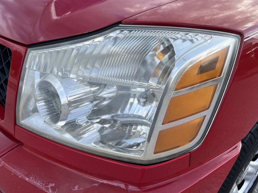 Used 2006 Red Alert Nissan XE image 10