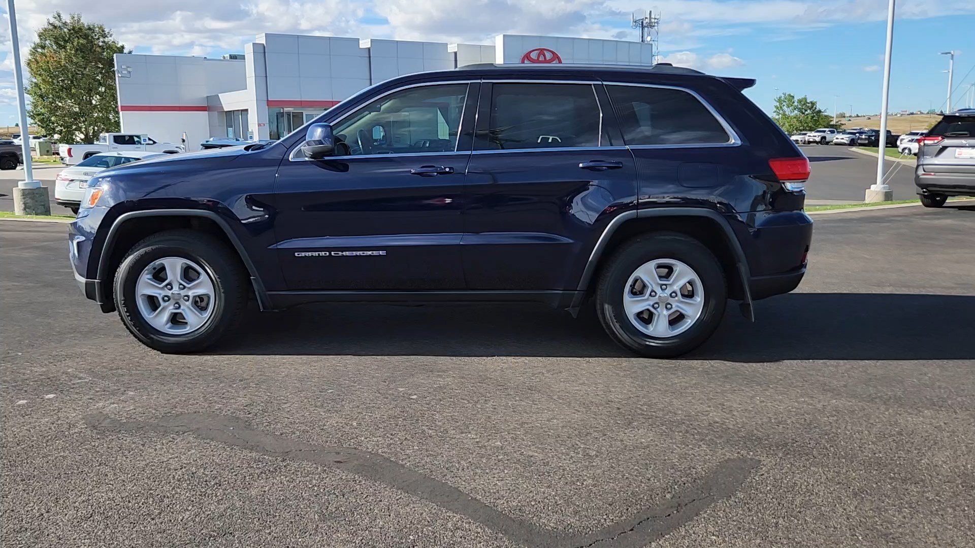 Used 2014 Jeep Grand Cherokee Laredo with VIN 1C4RJFAG5EC202678 for sale in Cheyenne, WY