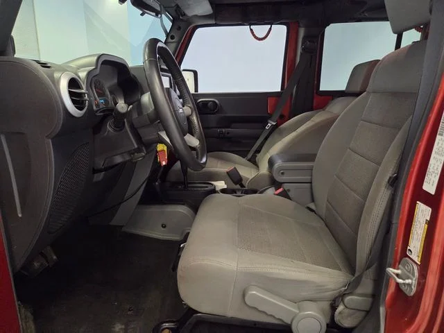 Used 2009 Orange Jeep Unlimited Sahara image 10