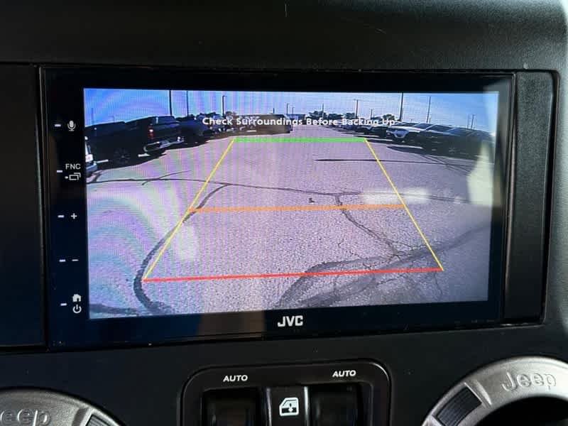 Used 2018 Granite Crystal Metallic Clearcoat Jeep Sport S image 16