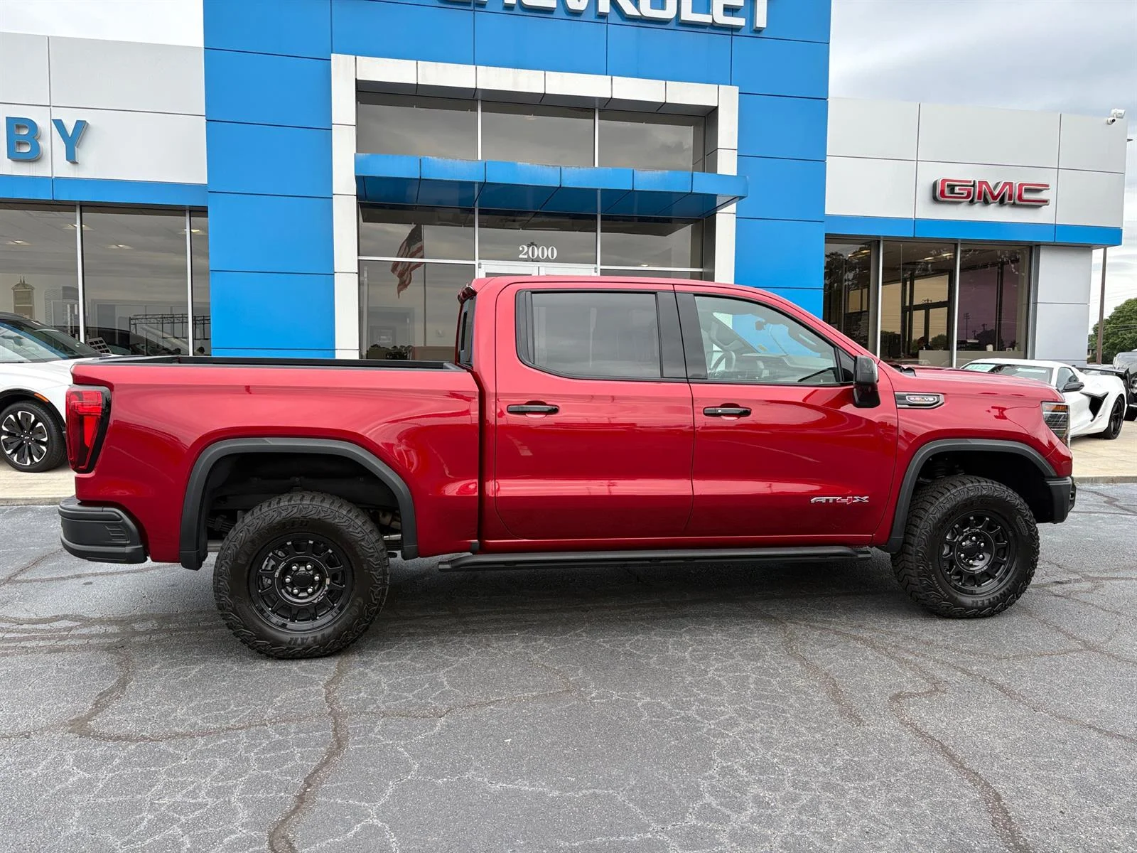 Used 2026 Volcanic Red Tintcoat GMC AT4X image 4