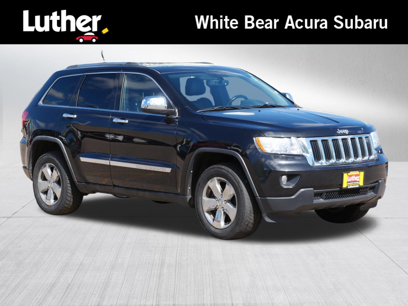 Used 2011 Brilliant Black Crystal Pearl Jeep Laredo image 1