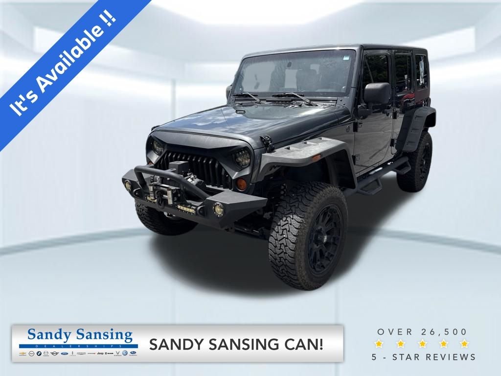 Used 2010 Gray Jeep Unlimited Sport image 1