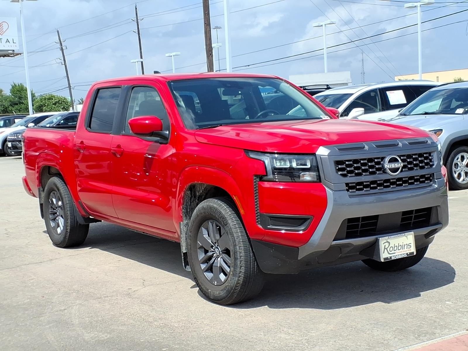 2026 Nissan Frontier SV Red at Robbins Nissan