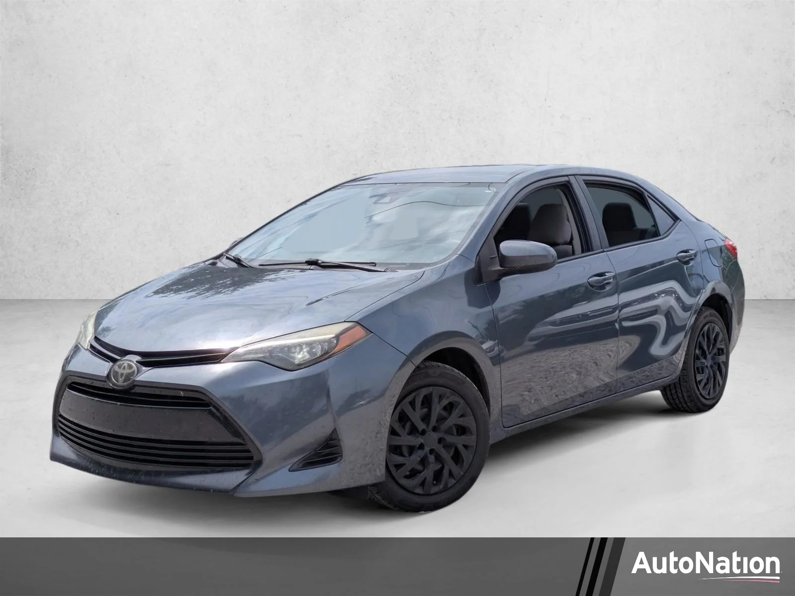 Used 2018 Slate Metallic Toyota LE image 1